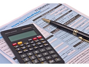 Tax forms, calculator and pen